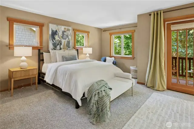 Spacious Primary Bedroom with lots of fir wrapped windows.