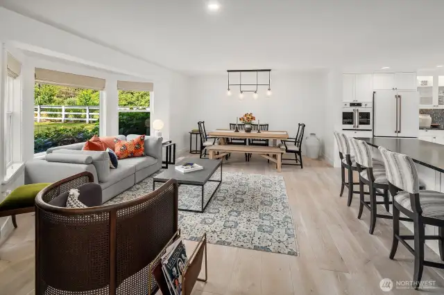Ppen concept living/dining greets you upon entering
