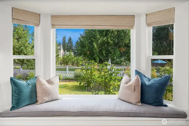 Stunning bay window & bench w/ perfect view of garden & windmill