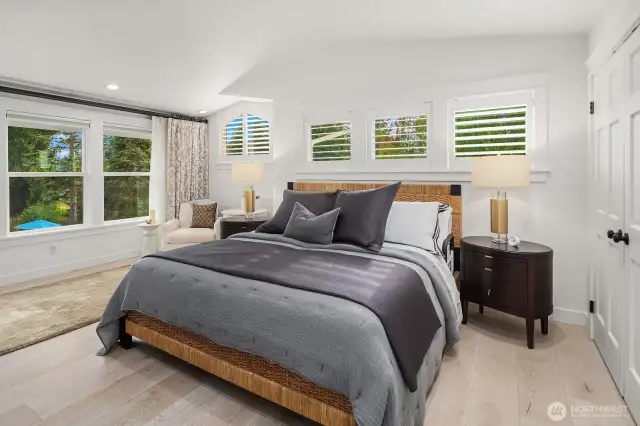 Large primary suite overlooking gardens & pool