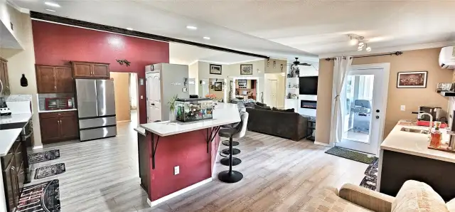 Exiting the Primary Bedroom Suite #2 into the open concept living/kitchen area.
