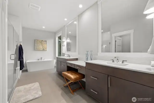 Primary bathroom enjoys a window over your private greenbelt views.