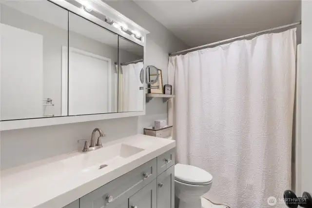 Full bathroom with tub and show.
