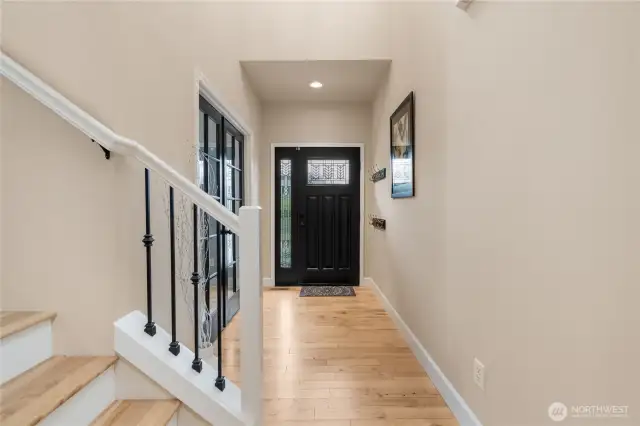 Another view of the entryway, with the office/den featuring French doors in the back left corner.