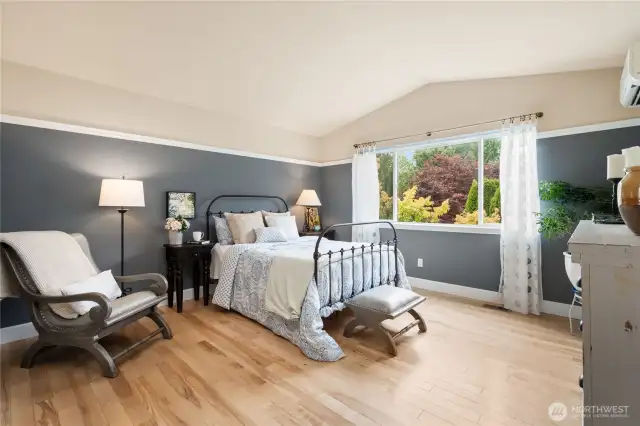 The elegant primary bedroom offers a serene retreat, complete with its own mini-split system for year-round comfort.