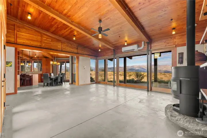 The living area connects directly to the kitchen and dining area. This space truly comes alive after dark, with the soft lighting bringing out the warmth of all the reclaimed Douglas-fir finish work.
