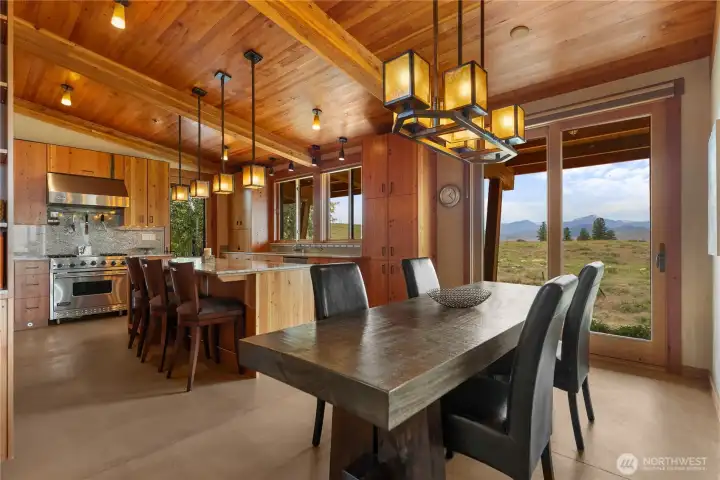 This generous dining nook is large enough for a table to sit up to 8. Another sliding door allows you to bring the sounds of nature in.