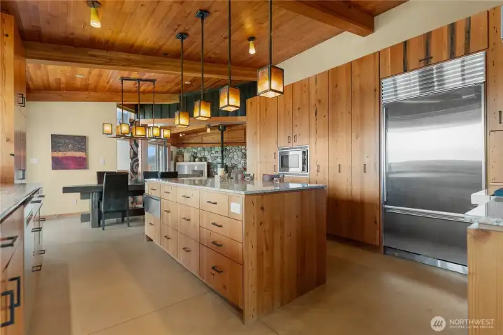 The kitchen appliances include a Viking range/oven, Sub-Zero fridge/freezer, and Bosch dishwasher as well as built-in warming drawer, wine cooler and convection microwave.
