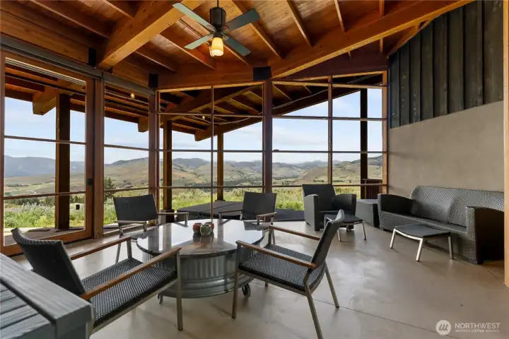 This screened living area showcases views of Mt. Gardner and the Pasayten for comfortable outdoor living in all seasons. A hot tub just outside calls for a soak on snowy days and star-filled nights - and if you time it right you will have aurora views as you soak.