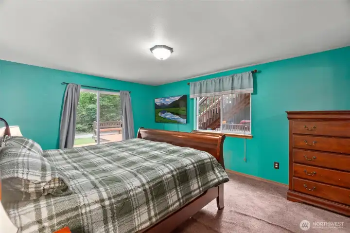 Primary bedroom with access out to the deck.