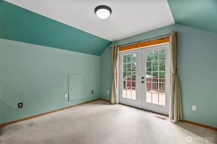 Upstairs bedroom with it's own private bath and french doors out to the deck.
