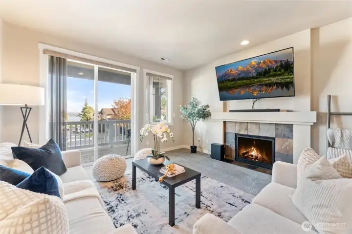Light and bright main living space with cozy gas fireplace.