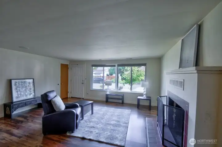 Step inside to this lovingly maintained and updated mid-century Olympia classic onto the laminate wood flooring, freshly painted home.
