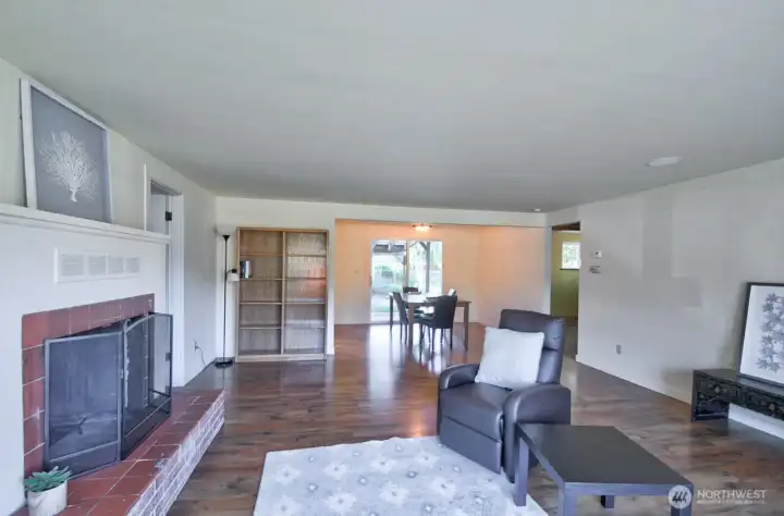 Wood fireplace in brick hearth.