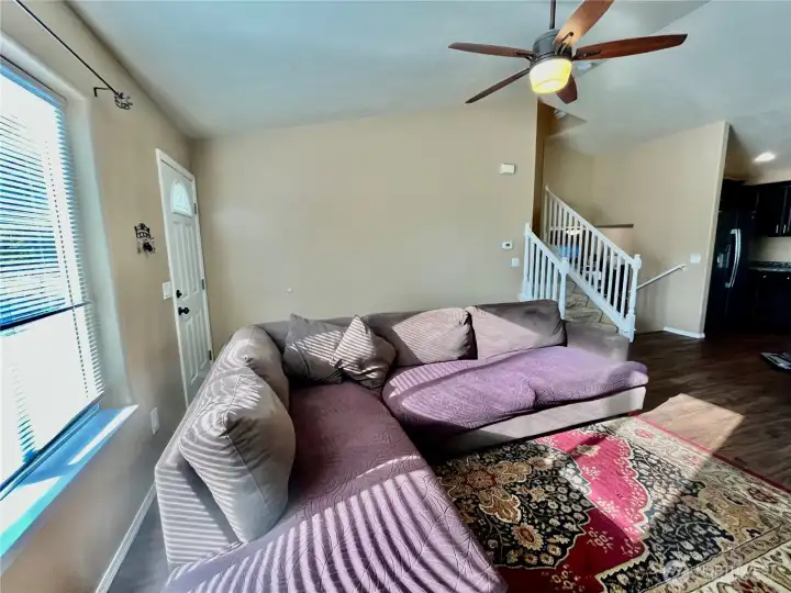 laminate floors and large window to bring in natural light