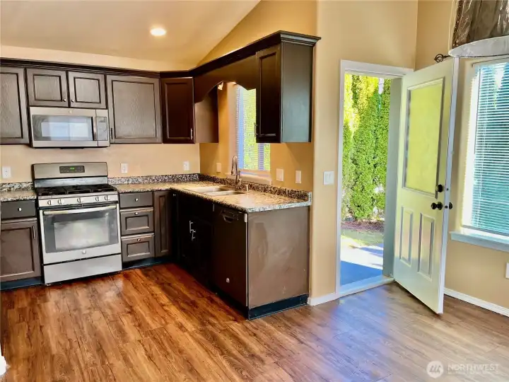 open floor plan with living room leading to dining room and kitchen