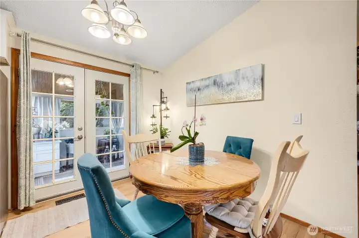 The dining room with French doors that go out to enclosed patio.