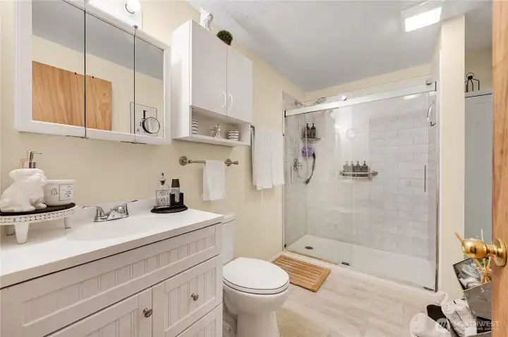 The main bath features a very large walk-in shower. Everything sparkles.