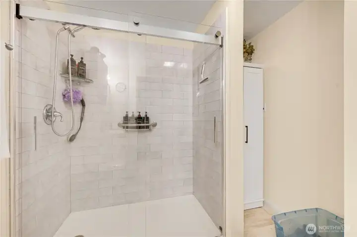 The big, beautiful shower, with additional storage on the right.