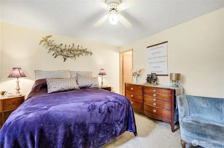 The spacious primary, the door on the right goes to private half bathroom.