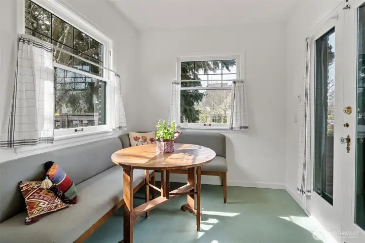 fantastic nook area just off the kitchen - double doors lead to patio.