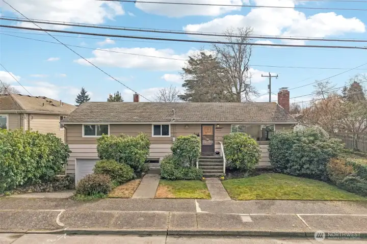 mature landscaping. Situated on a quiet, tree-lined street with ample off-street parking.