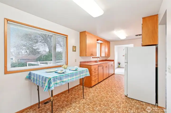 Eating Space in kitchen. Add a table or hightop with stools.