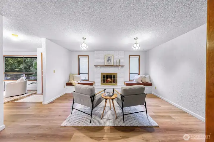Amazingly cozy secondary living room with wood burning fireplace and built in bench seats.