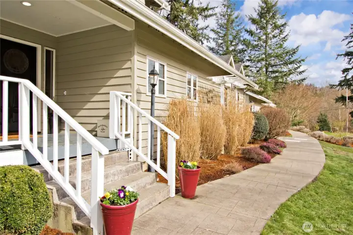 andscaped walkway leading to the front entry.