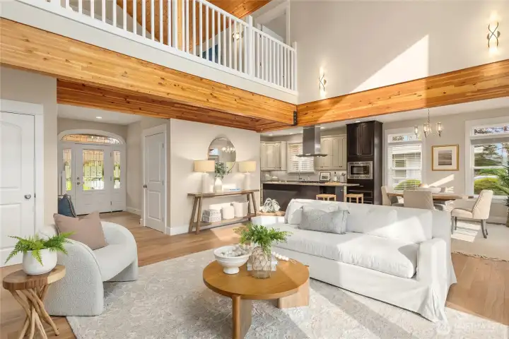 This view showcases the solid wood beams that add architectural charm to this home.