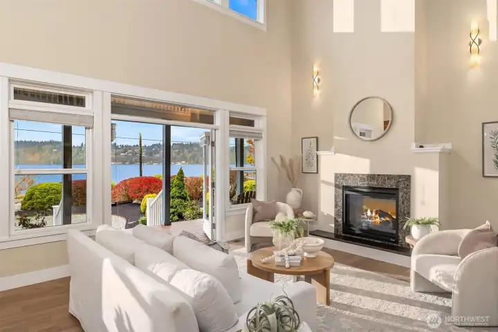 The cozy propane fireplace is double-sided and can be enjoyed from the great room and the primary ensuite.