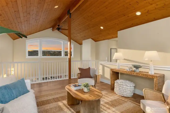 Featuring a tongue and groove ceiling and expansive picture windows.