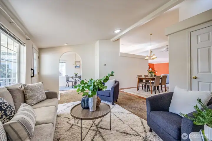 Kitchen breakfast nook through the arched doorway.