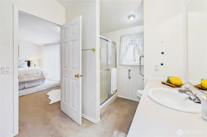 Step in shower - plenty of grab bars already installed.