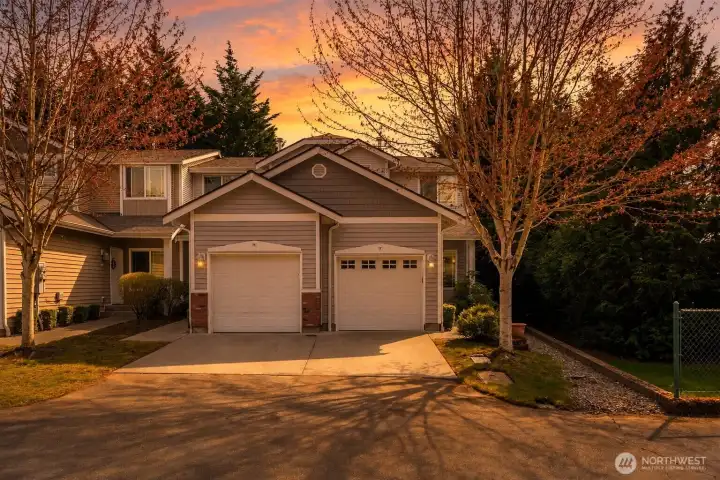 End Unit with oversize garage. extra parking for guest by the fence and guest parking.