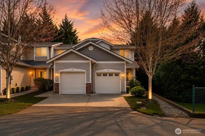 End Unit with oversize garage. extra parking for guest by the fence and guest parking.