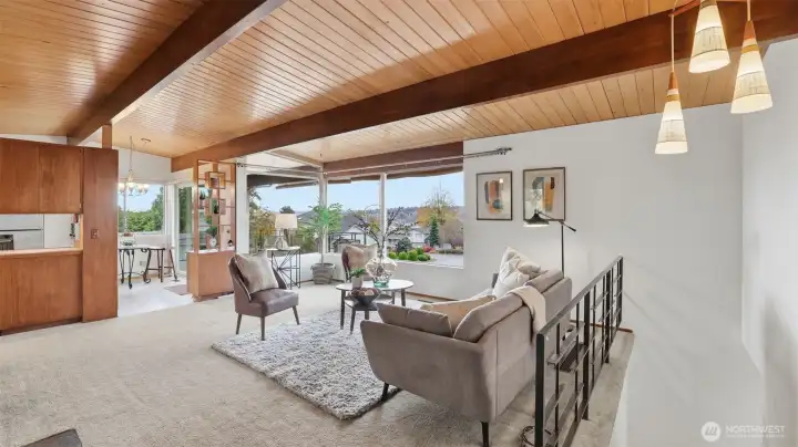 Mid-century charm meets comfortable living with abundant natural light, open-concept spaces, and seamless flow between the kitchen, dining, and living areas