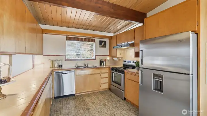 Matching stainless steel appliances and appeal and function in this spacious kitchen. Don't miss the custom spice cabinet!