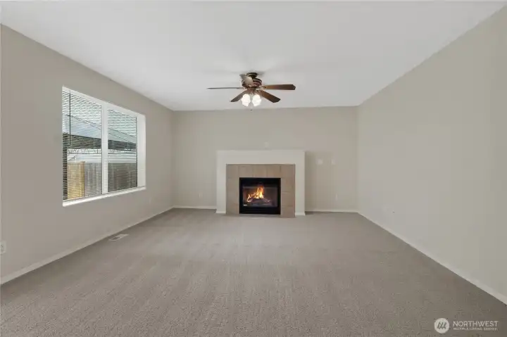 Family room offers a gas fireplace.