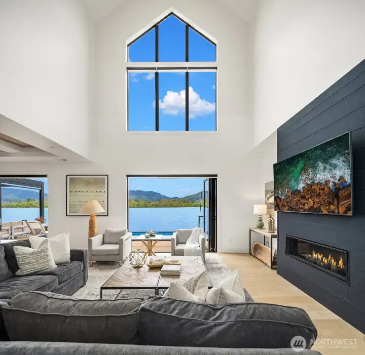 Soaring ceiling, dramatic views and a stylish fireplace beckons you to come in and relax!