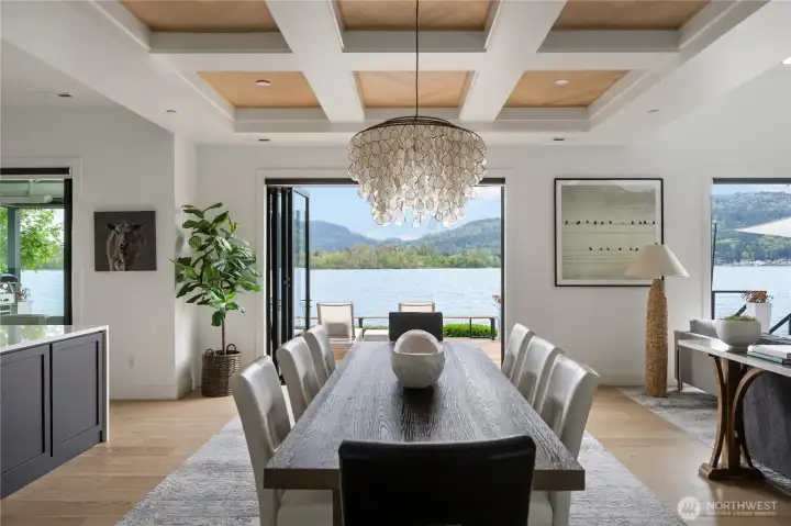 Coved ceiling define the dining area and the folding doors create a sense of one with nature for ideal al fresco living.
