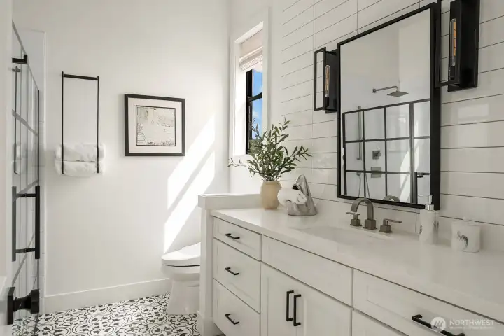 Guest Bathroom is crisp and tucked away.