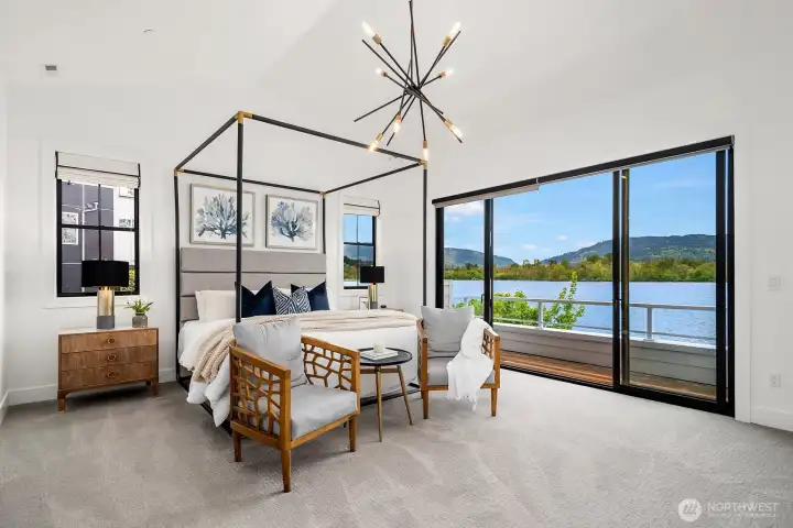 Exquisite primary suite with it's own private deck, ideal for enjoying a night cap prior to being lulled asleep to the sound of waves slashing at the shore's edge.