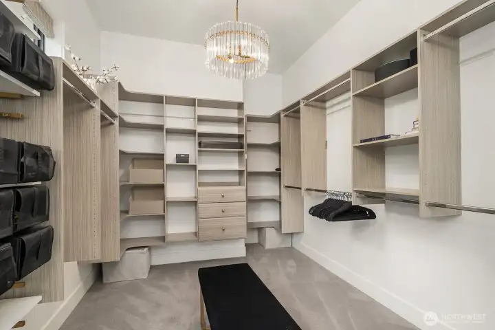 Pinch me!  This is only half of the massive walk-in closet in the primary suite.