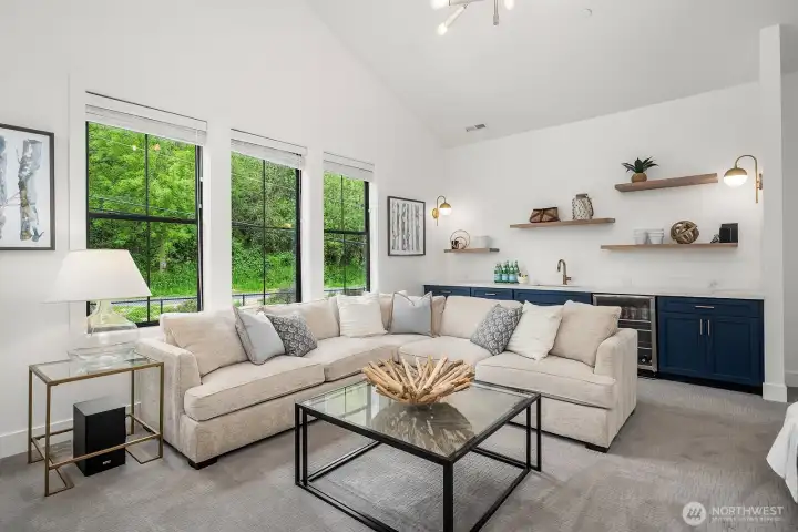 The bonus room upstairs sports a wet bar, beverage fridge and food storage etc.