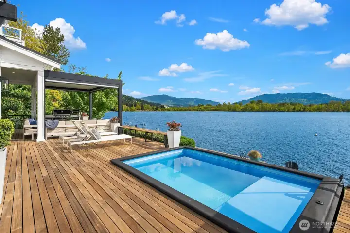 Talk about party central!  A built in bbq with covered seating area at one end of the massive 1200 sf ironwood deck with a central plunge pool and flanked by a dining pavillion means outdoor living here includes every bell and whistle imaginable!