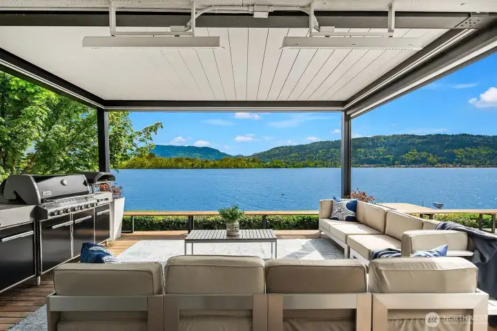 Ideal for the NW weather, enjoy the covered seating area with infrared heaters and a generous sectional for relaxing at the shore's edge.