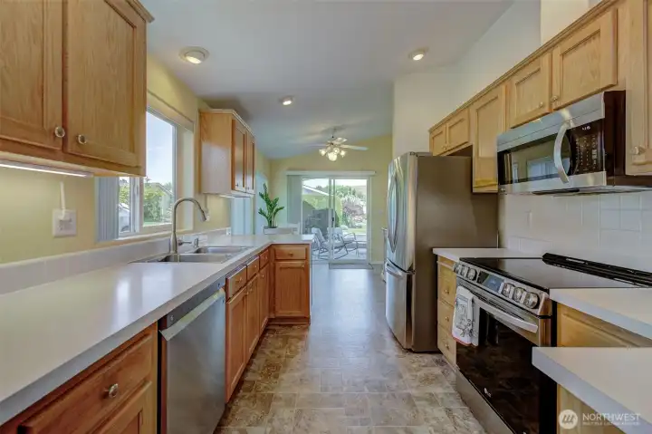 A kitchen for the cook to enjoy! Ample storage, new SS appliances, oversized fridge and under-cabinet lighting!