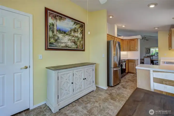 View from the Breakfast room into the kitchen area (pantry door on left)