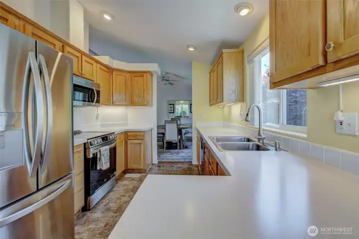 Plenty of counter space for every food and beverage-prepping adventure! Notice oversized SS fridge w/french doors...